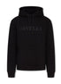 Black ORVELLA luxury hoodie front view with tonal chest logo, drawstring hood, front pouch pocket, ribbed cuffs, and structured premium streetwear fit.