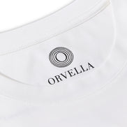 Close-up of the Billionaire by ORVELLA white luxury T-shirt inner neck print, showing the ORVELLA logo, ribbed collar, clean stitching, and refined fabric detail.