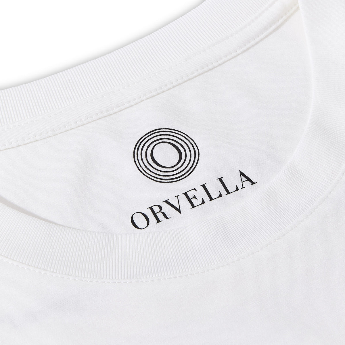 Close-up of the Billionaire by ORVELLA white luxury T-shirt inner neck print, showing the ORVELLA logo, ribbed collar, clean stitching, and refined fabric detail.