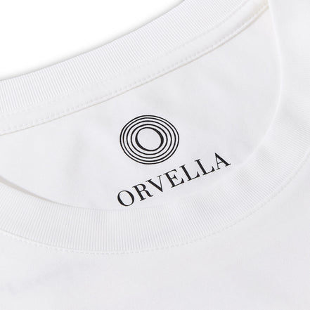 Close-up of the Billionaire by ORVELLA white luxury T-shirt inner neck print, showing the ORVELLA logo, ribbed collar, clean stitching, and refined fabric detail.
