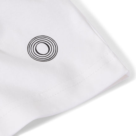 Close-up of the Billionaire by ORVELLA white luxury T-shirt sleeve, showing the signature circular emblem, clean stitching, and smooth premium fabric detail.