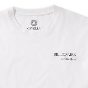 Close-up of the Billionaire by ORVELLA white luxury T-shirt, showing the chest branding, inner neck logo, clean collar stitching, and smooth premium fabric.