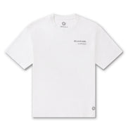 Billionaire by ORVELLA white luxury T-shirt front view with subtle chest branding, inner neck logo, signature hem emblem, and clean premium streetwear design.
